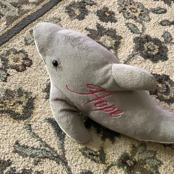 Dolphin stuffed animal says HOPE  with pink stitching . In good shape - Picture 4 of 5